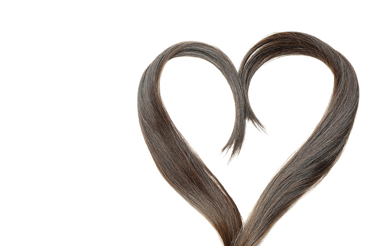 Bild zeigt Herz mit Haarsträhne